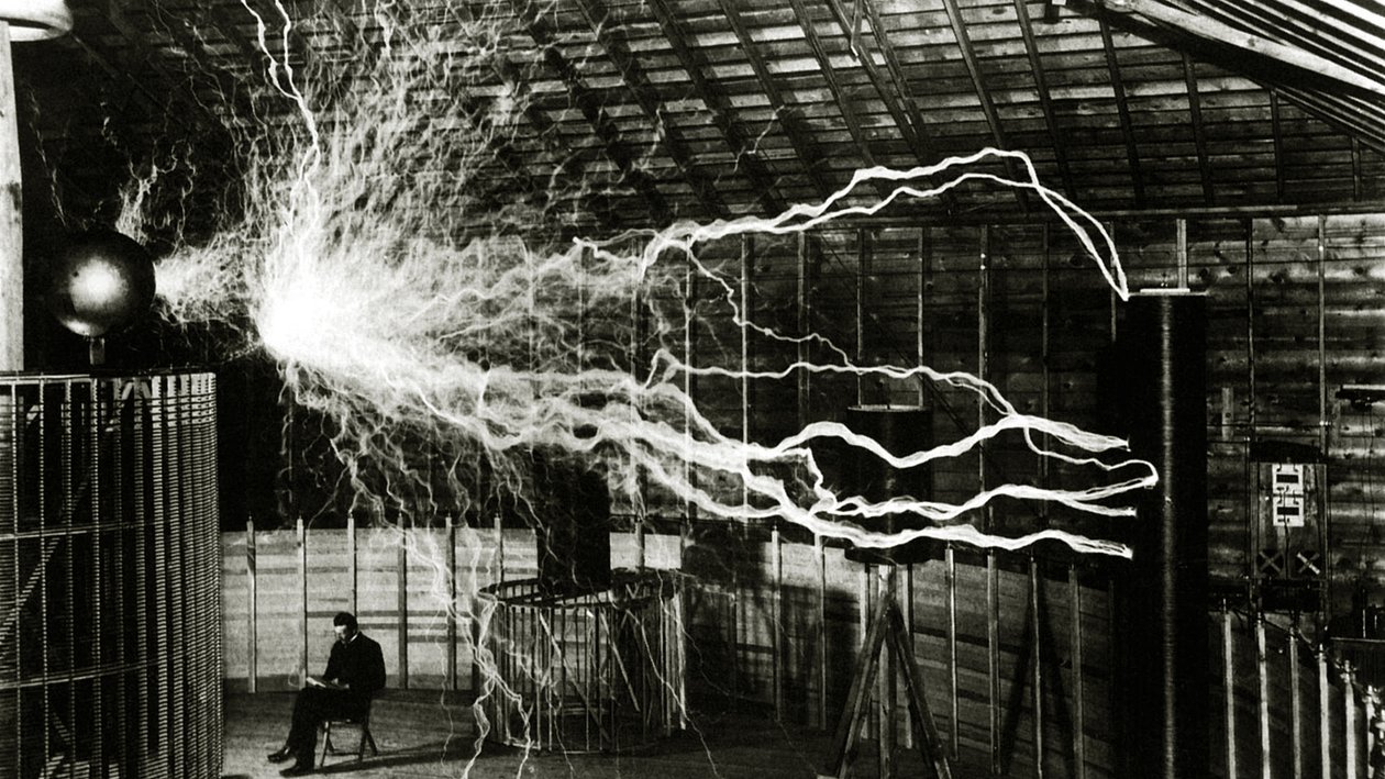 A Multiple Exposure Picture of Tesla with His Magnifying Transmitter by Unknown