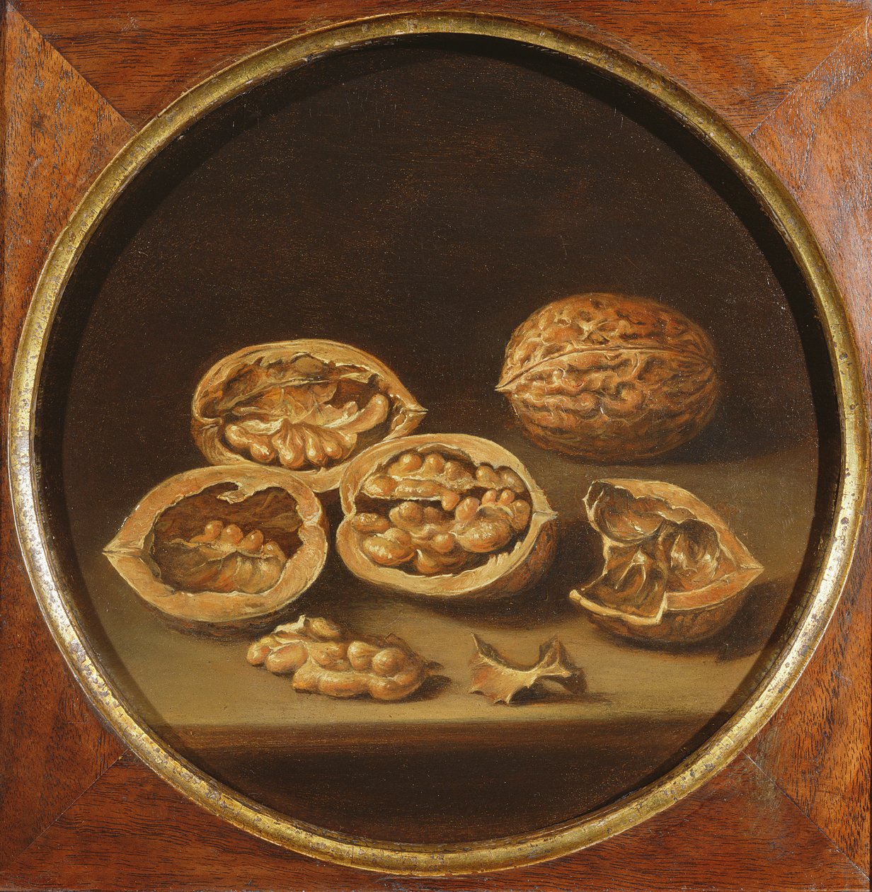 A Still Life of Cracked Walnuts resting on a Stone Ledge by Antonio Pereda y Salgado