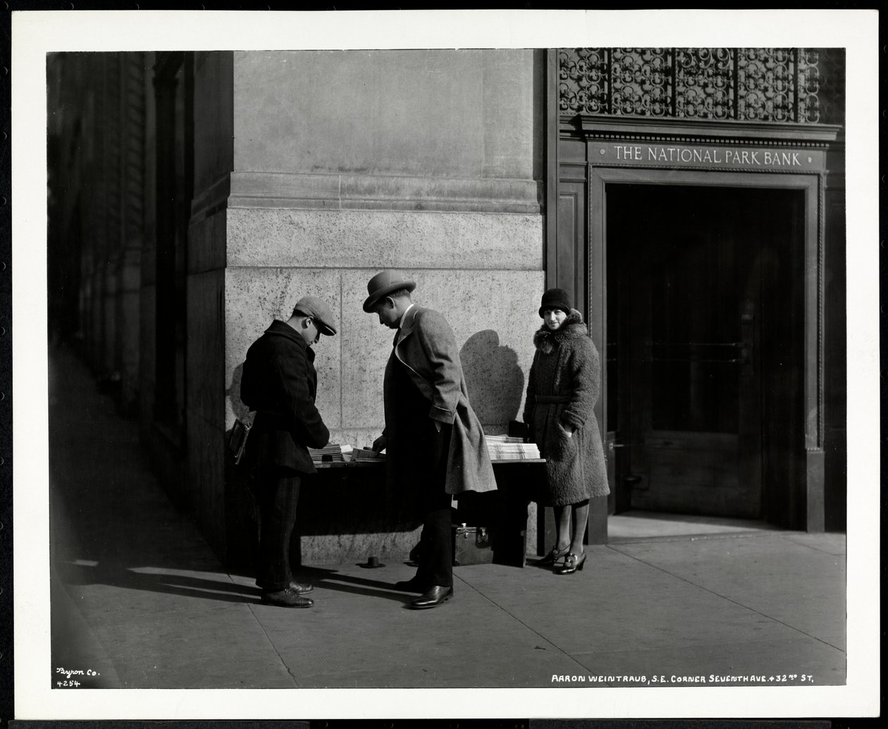 Blind News Dealer, Aaron Weintraub, at His Stand at the South East Corner of 7th Avenue and 32nd Street, New York, 1930 by Byron Company