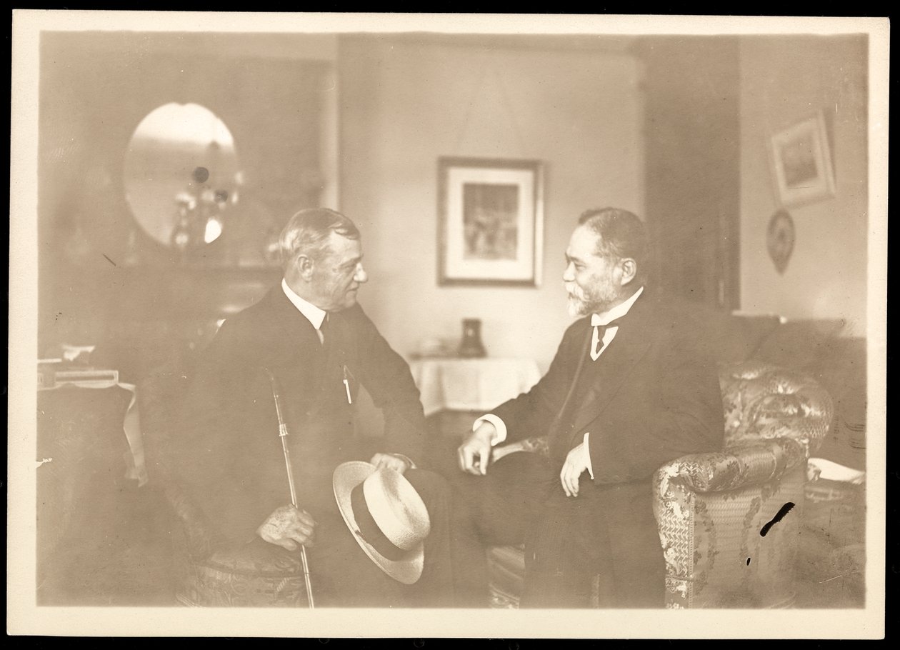 Rear Admiral Robley Dunglison Evans seated with another man by Byron Company