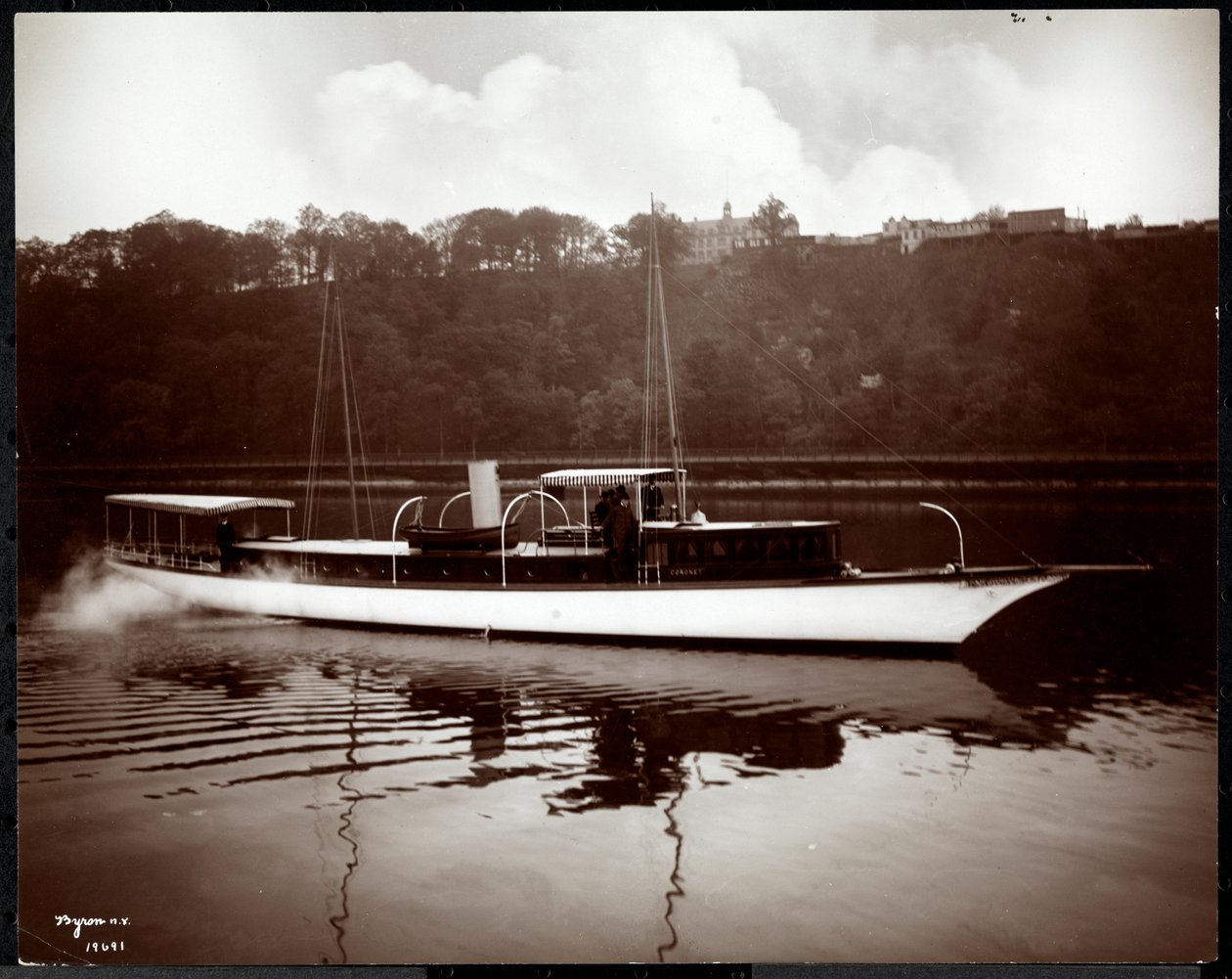 View of the yacht Coronet of the New York Yacht, Launch und Engine Co. on the Harlem River, New York by Byron Company