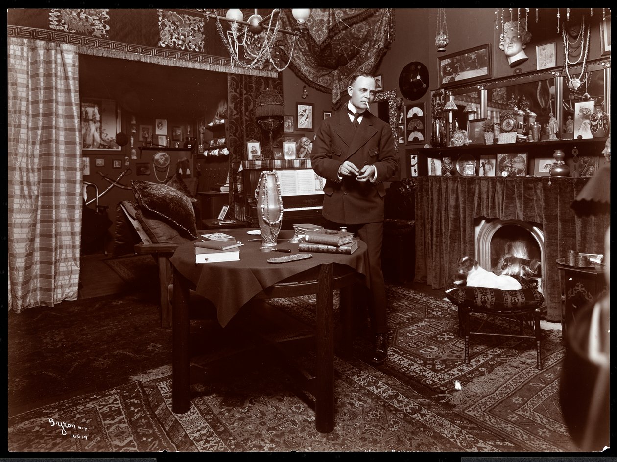 Will R. Barnes Standing at a Table in His Studio by Byron Company