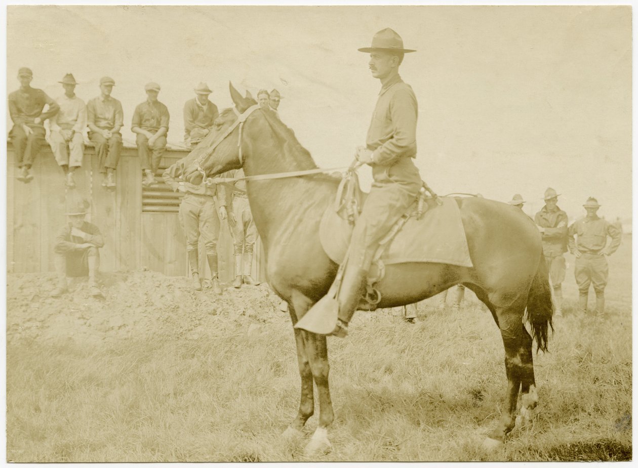 Soldiers Gathered Around and Watching a Uniformed Soldier on Horseback in a Grass Field by Carl Michel