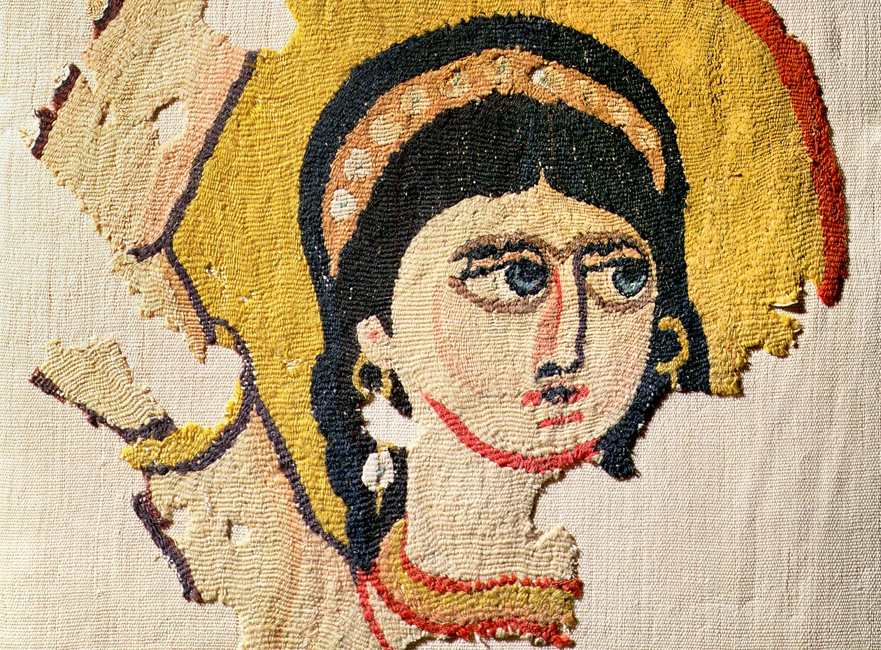Fragment of a tapestry depicting the head of a dancer (detail) by Coptic