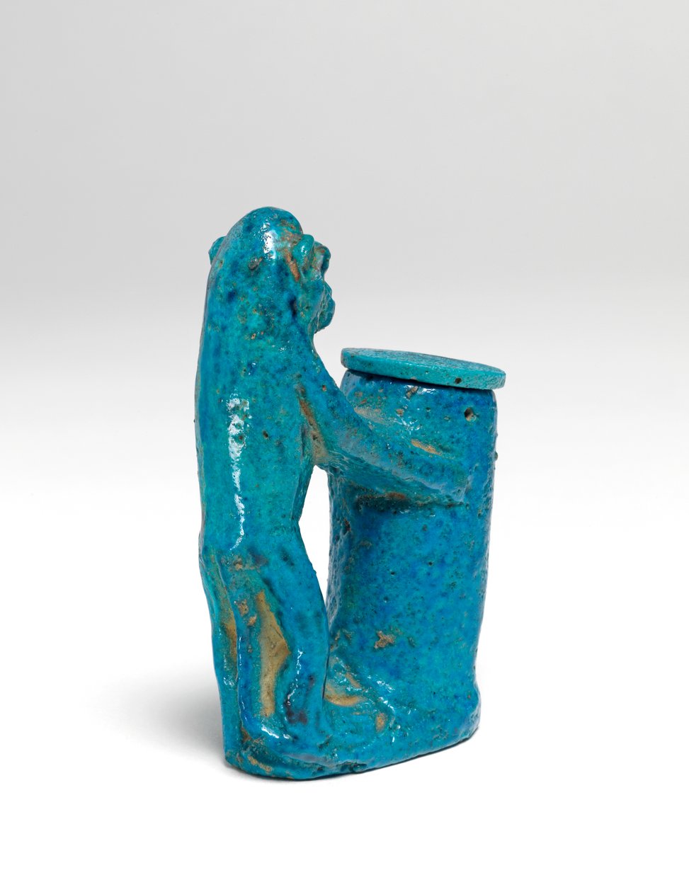 Kohl pot, in the form of a monkey faience by Egyptian 18th Dynasty
