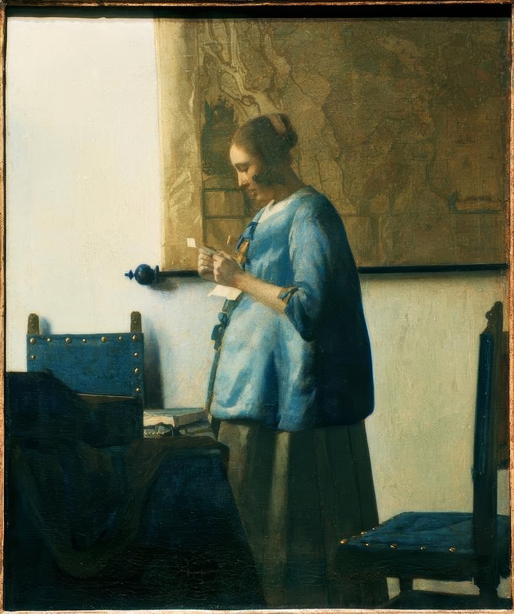 Woman Reading a Letter in Blue by Jan Vermeer van Delft