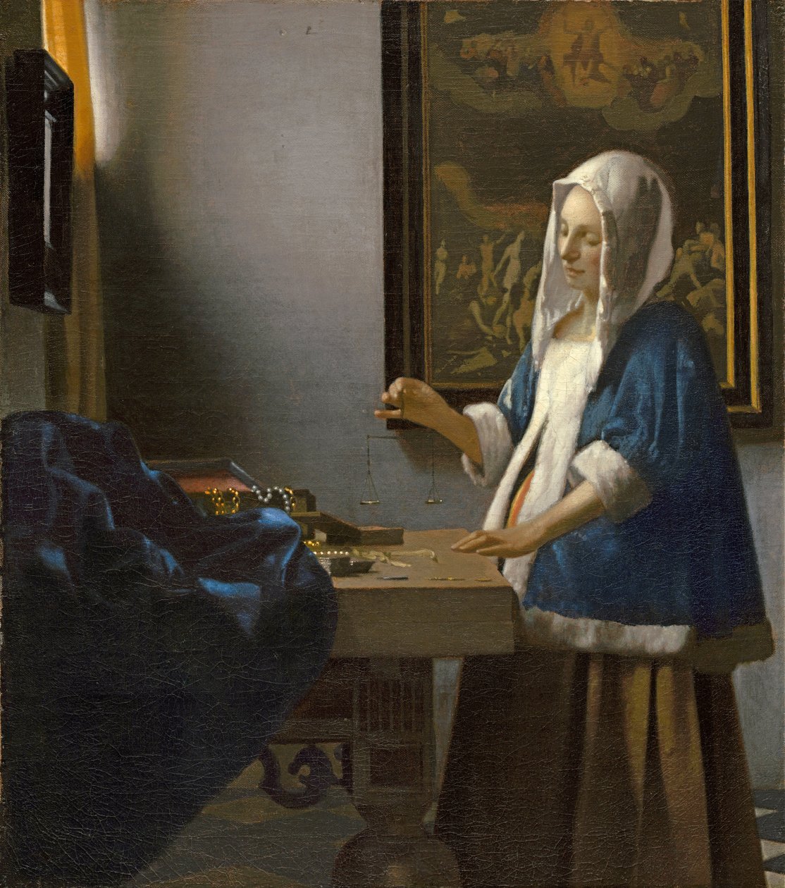 Woman Holding a Balance by Jan Vermeer van Delft