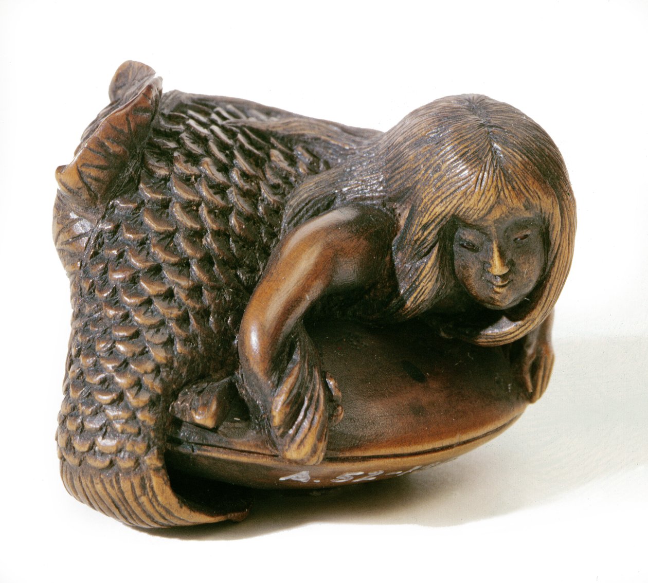 Netsuke carved in the shape of a mermaid by Japanese School