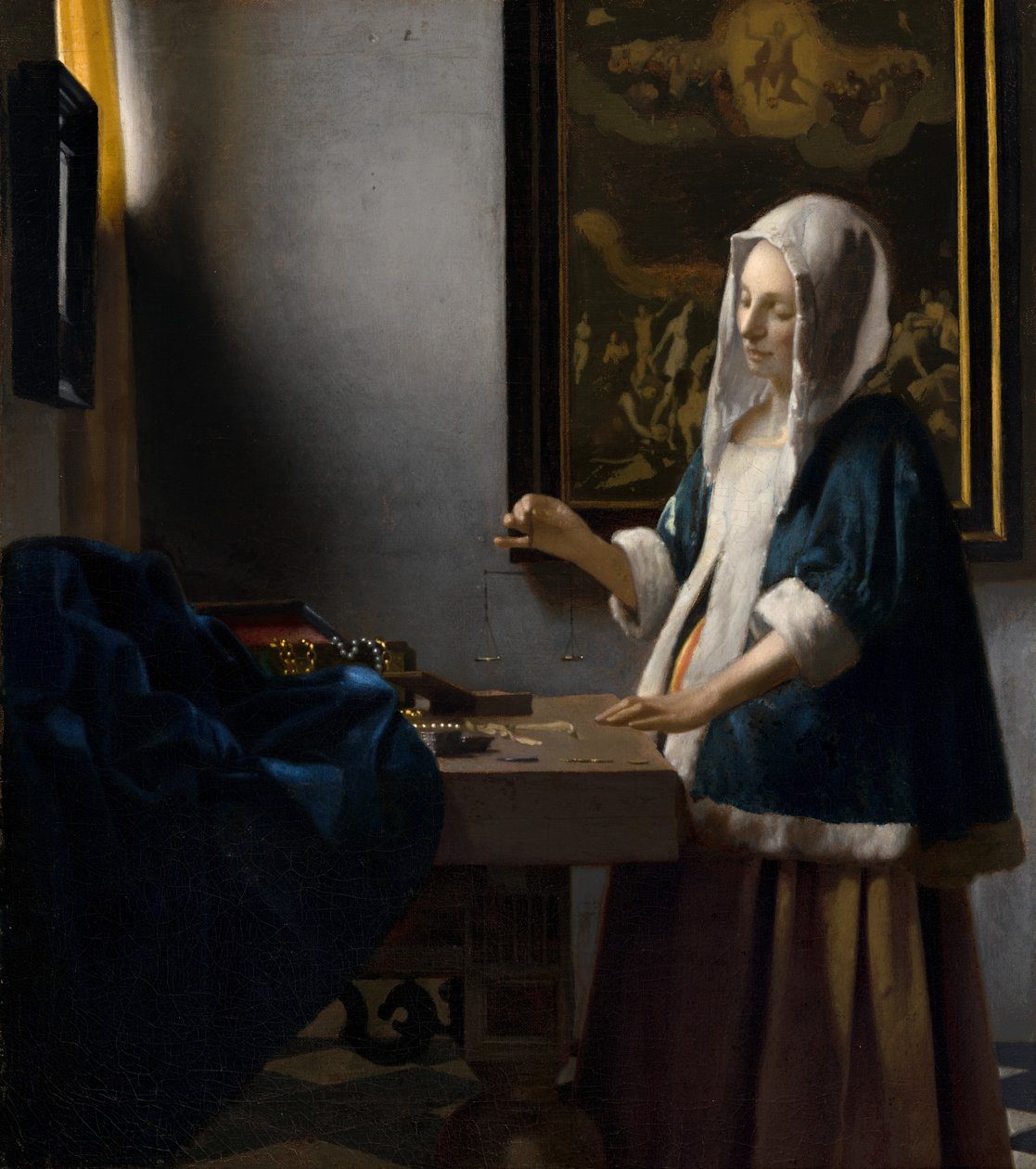 Woman Holding a Balance by Johannes Vermeer