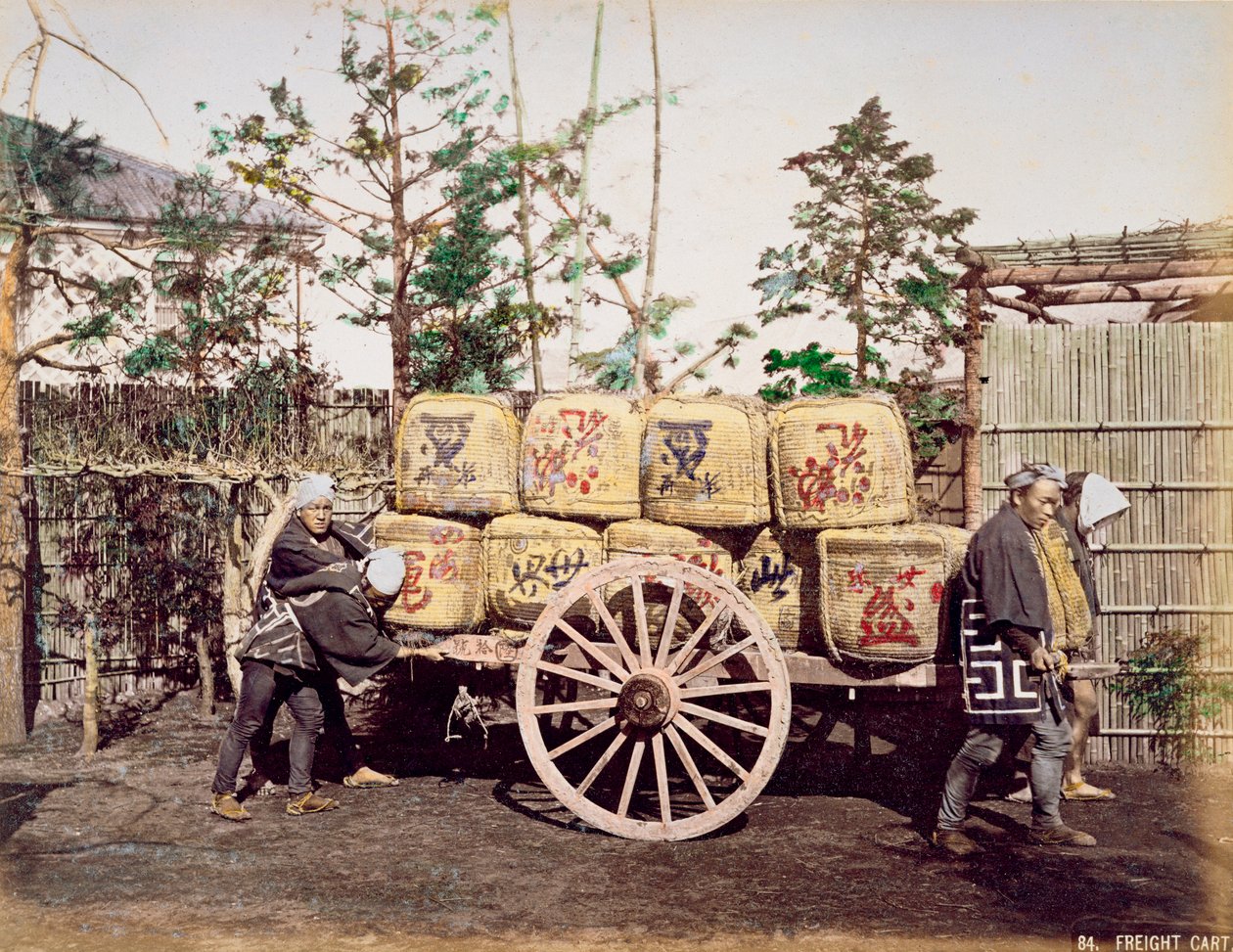 Freight being transported on a hand drawn cart by Kusakabe Kimbei