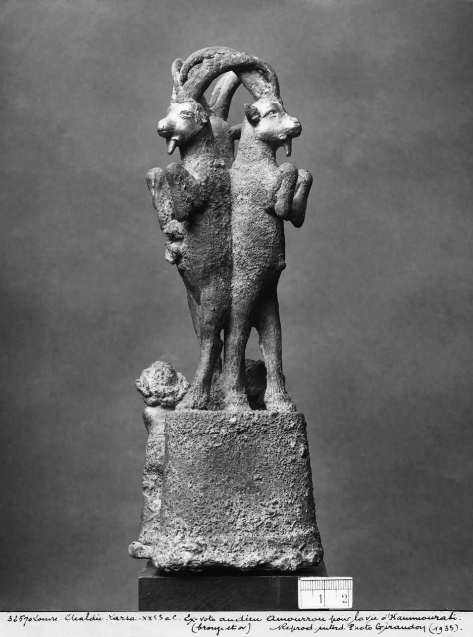 Cup stand made up of three ibexes, back view by Mesopotamian