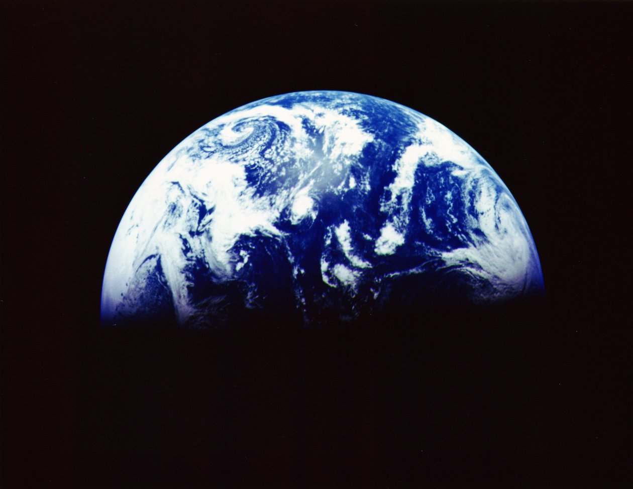 Earth from Space photographed by spacecraft Galileo 11, December 1992 from a distance of 1.9 million km (1.2 million miles). Antarctica at the bottom, and dawn rising over the Pacific Ocean by National Aeronautics and Space Administration National Aeronautics and Space Administration