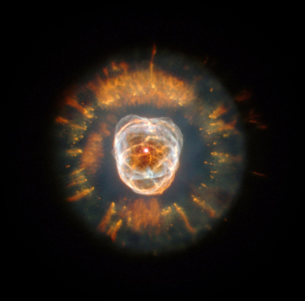 Eskimo Nebula, a planetary nebula, discovered by William Herschel in 1787 by National Aeronautics and Space Administration National Aeronautics and Space Administration