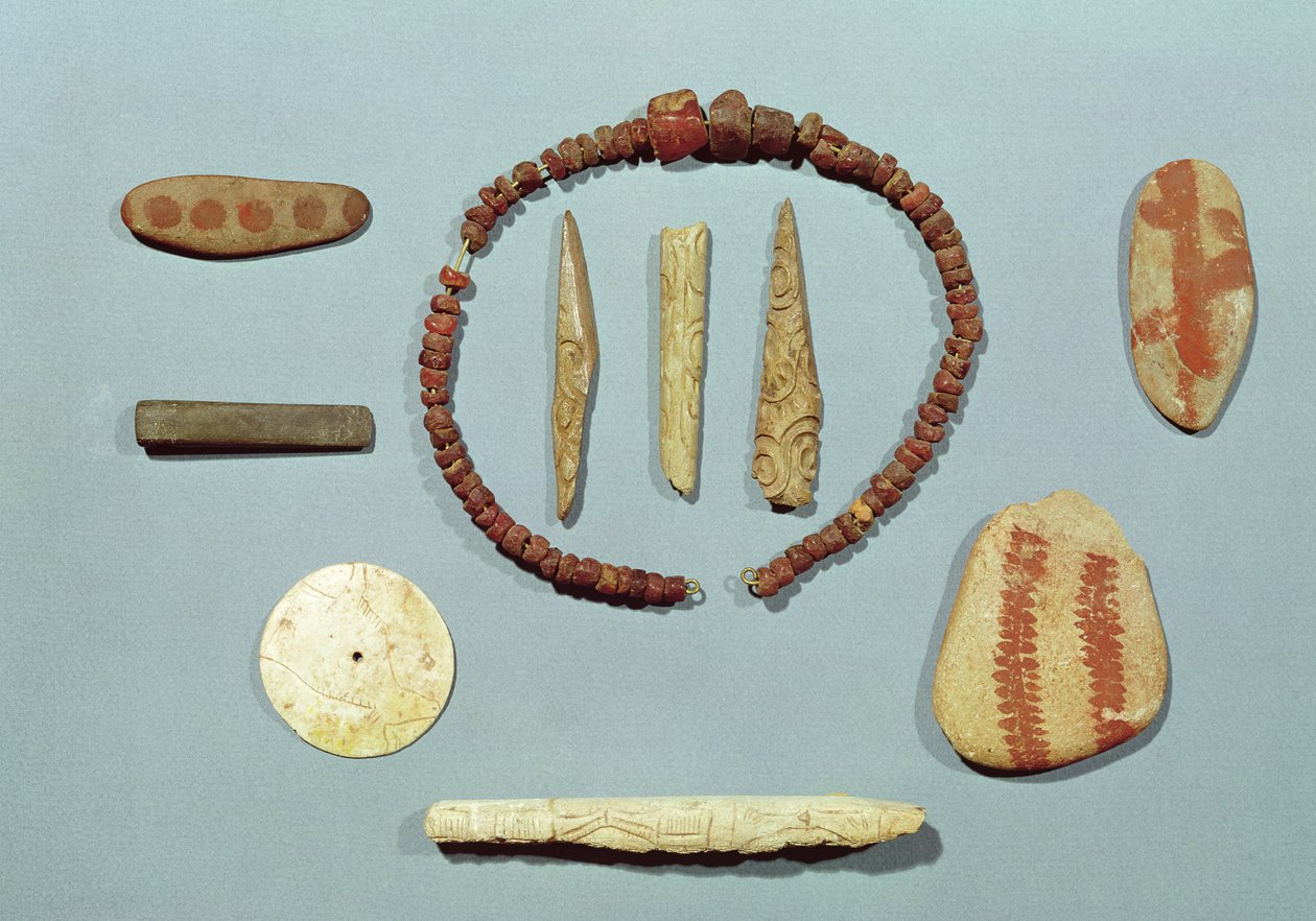 Three stones with red markings from Mas-d