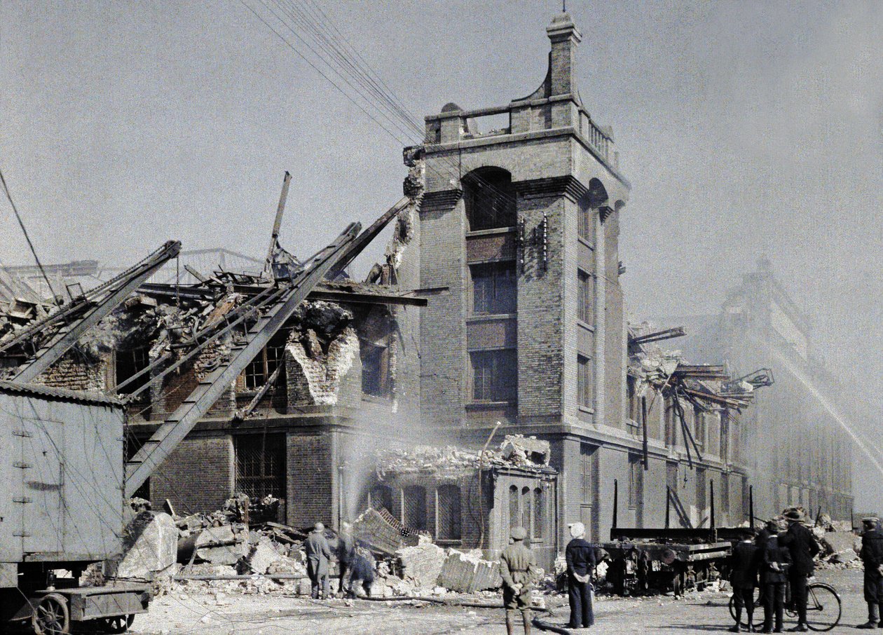 French fire fighters, military and civilians trying to prevent fires from spreading after the bombings of September 2 and 3, which affected several buildings in Dunkirk by Paul Castelnau