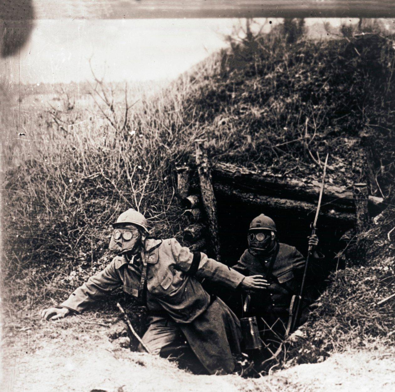 Soldiers in Gas Masks Emerging from Trenches by Unbekannt