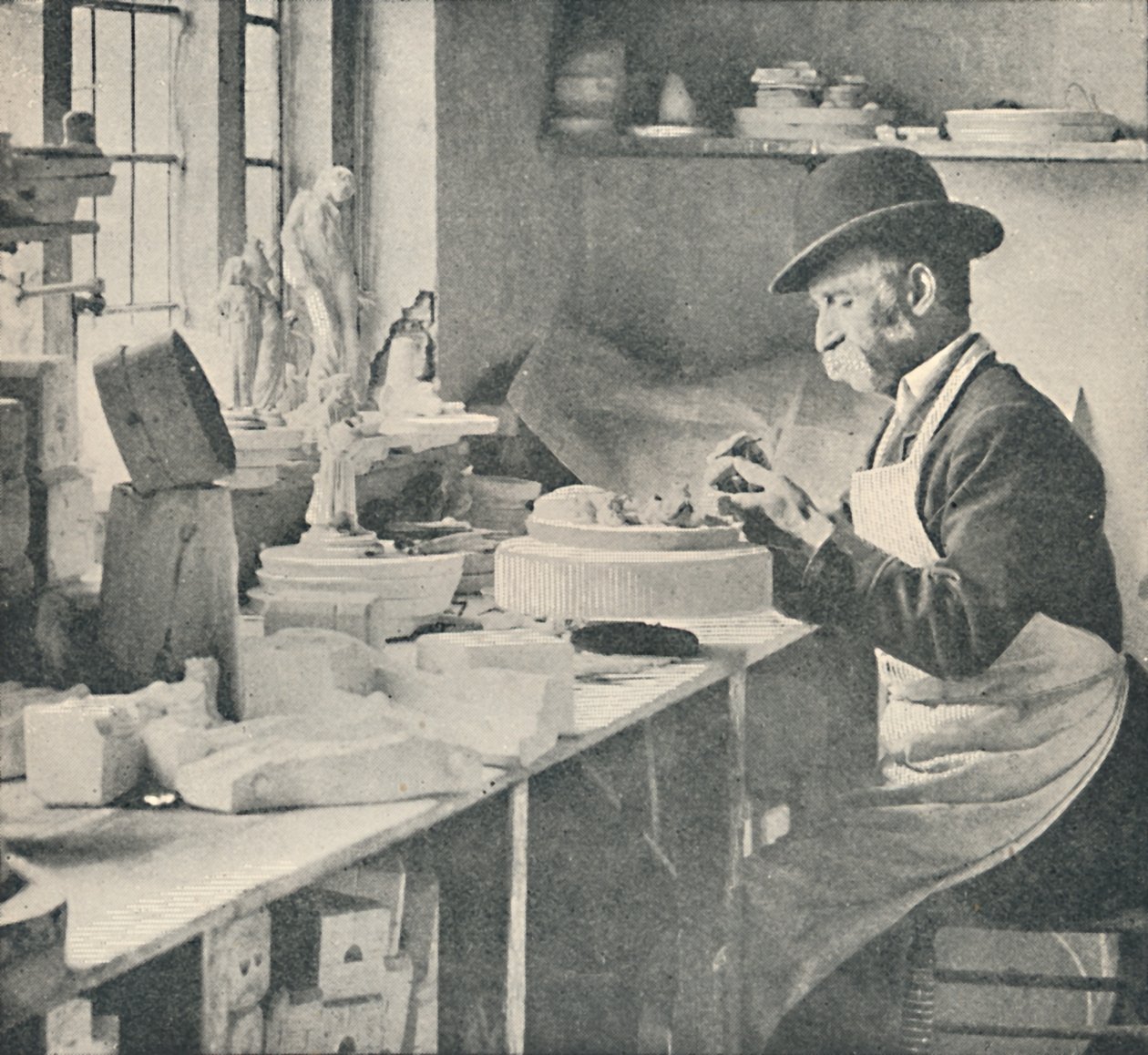 Trimming up parts of raw clay by Unbekannt