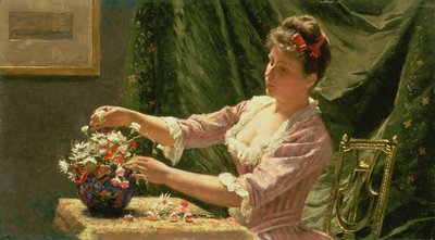 Young Woman Arranging Flowers by Emile Claus