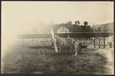 Group Portrait in Front of Airplane by Fedele Azari