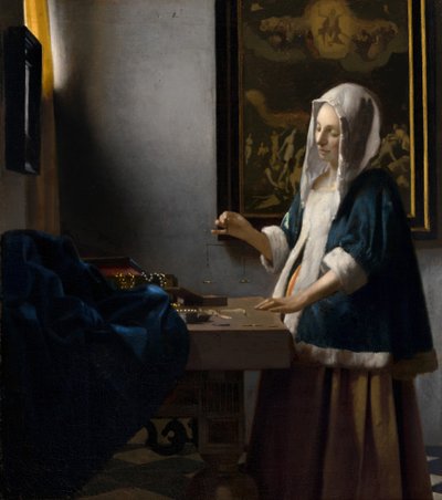 Woman Holding a Balance by Johannes Vermeer