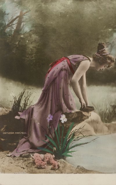 Woman looking into a pond by Studio Reutlinger