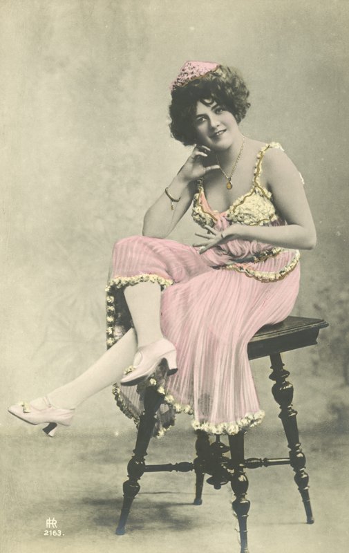Actress with Nice Smile in Pink Dress Sitting on Stool by French Photographer