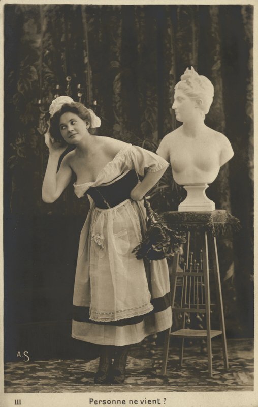 French maid dusting a bust by French Photographer
