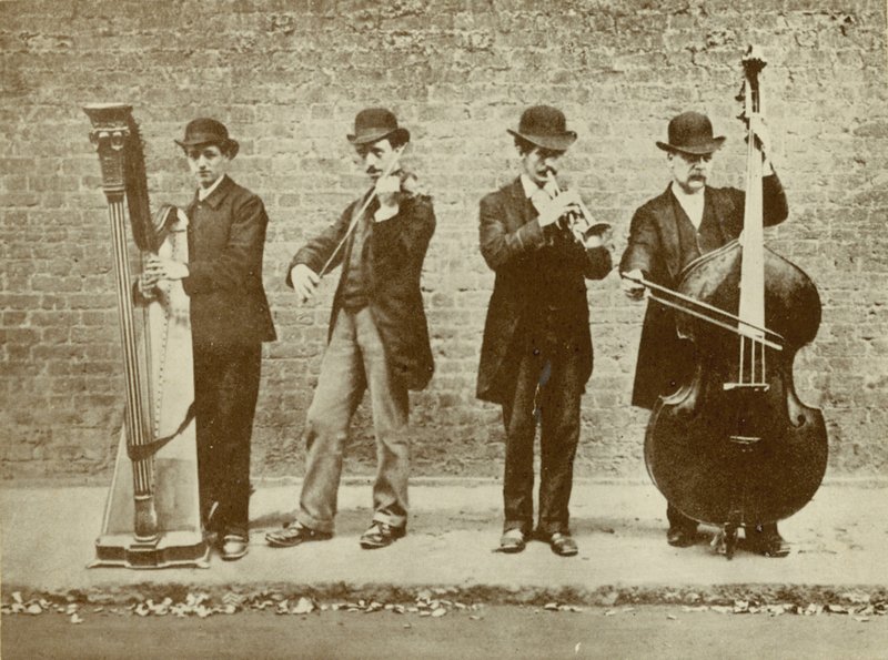 A Group of Street Musicians by English Photographer