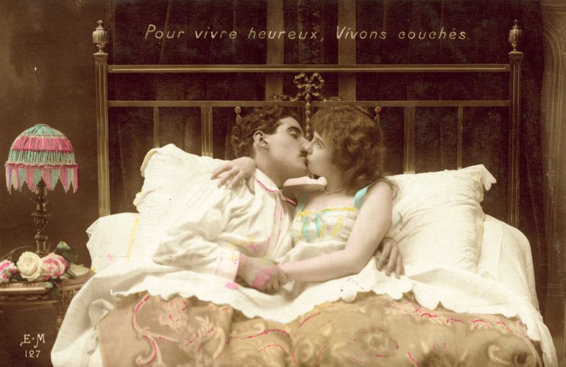 Couple Kissing in Bed by French Photographer
