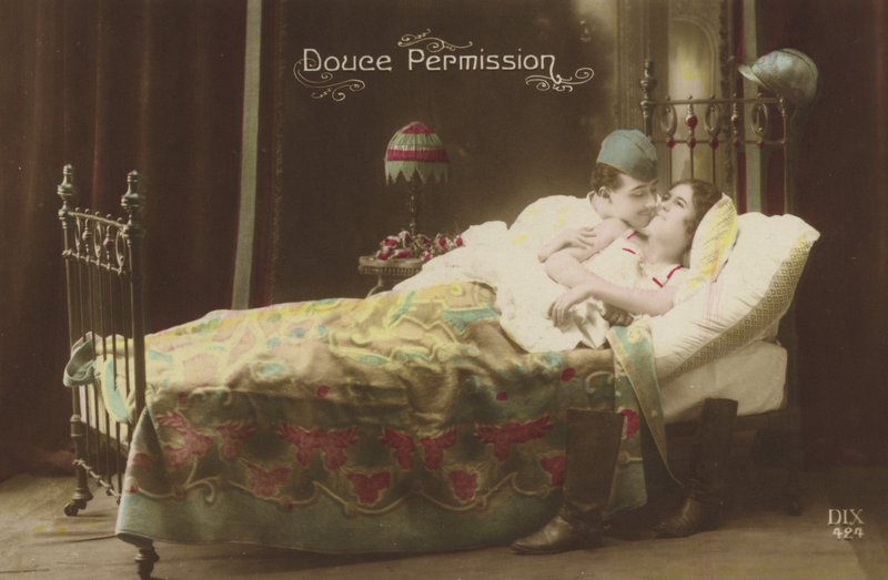Couple kissing in bed by French Photographer