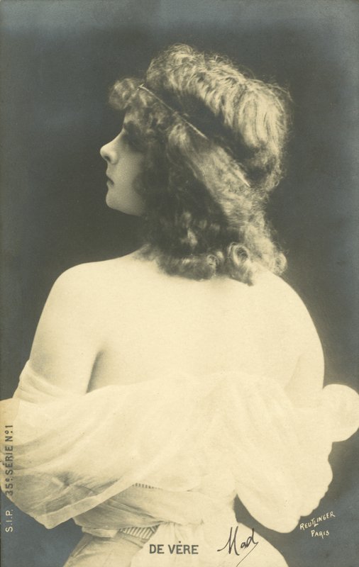 Girl looking over her shoulder by French Photographer