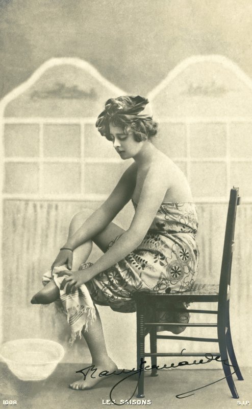 Woman in a bath towel by French Photographer